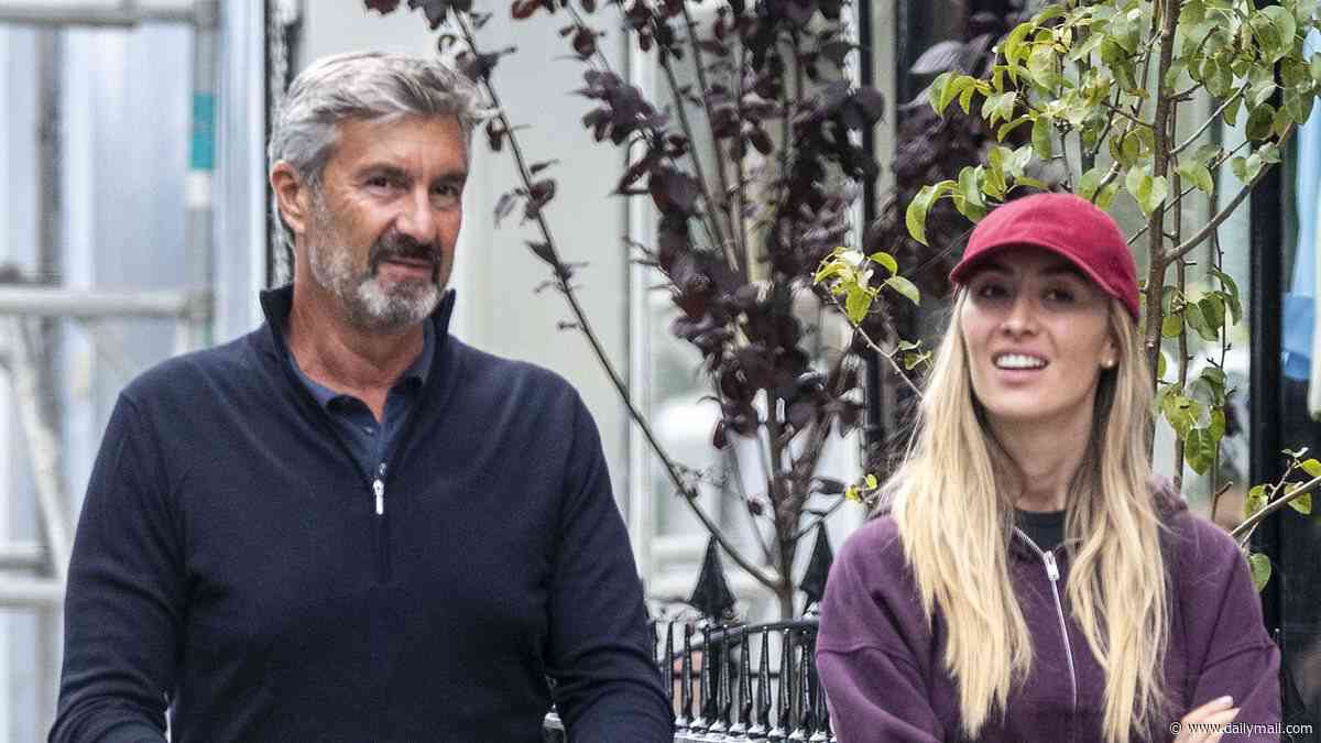 Sophie Habboo dotes on her baby son Ziggy as she enjoys a family day out with her father Patrique in Notting Hill