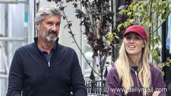Sophie Habboo dotes on her baby son Ziggy as she enjoys a family day out with her father Patrique in Notting Hill