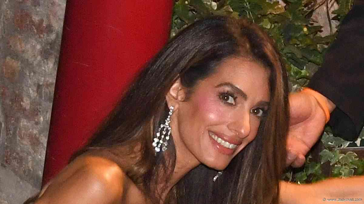 Amal Clooney needs a helping hand to exit her boat as she swaps red carpet gowns for a sparkly fringed mini dress during a night out with husband George in Venice