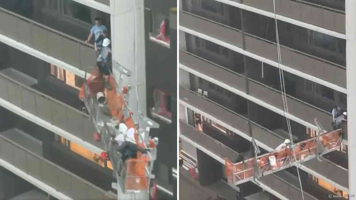 Video shows 2 workers escaping moving scaffold during thunderstorm
