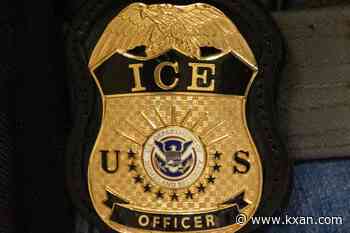 ICE officer charged with lying about shooting turns himself in to feds, AP source says