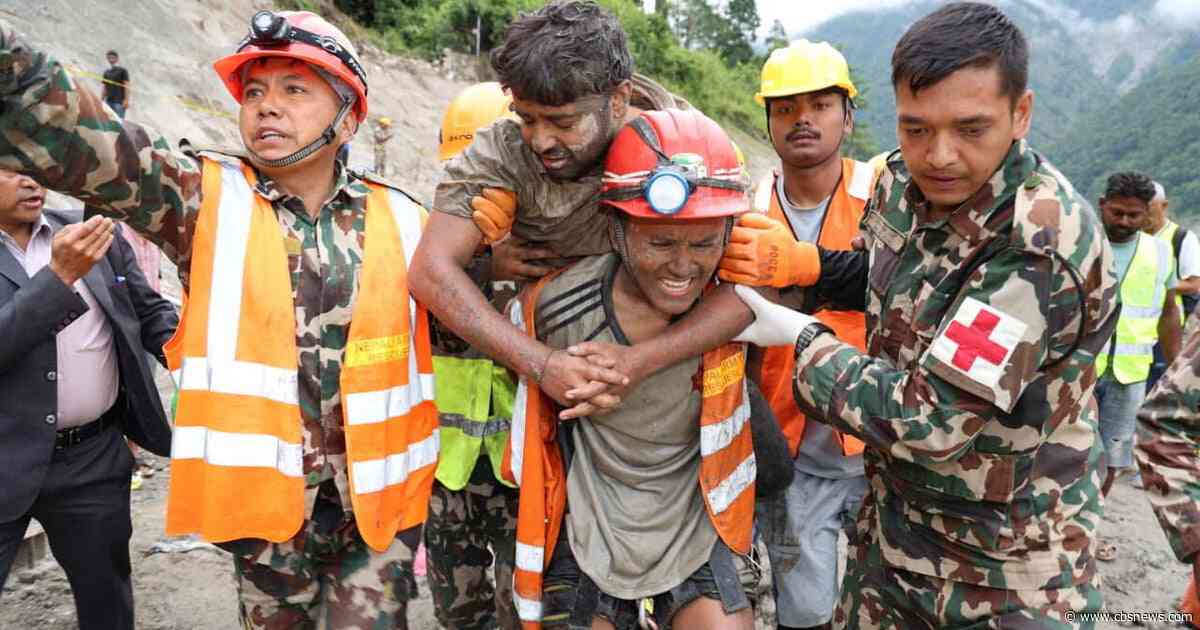 2 trapped Nepal workers rescued from buried tunnel 9 days after floods