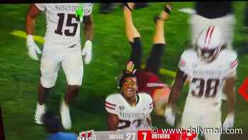College football star sends helpless woman crashing to the turf in brutal mid-game collision