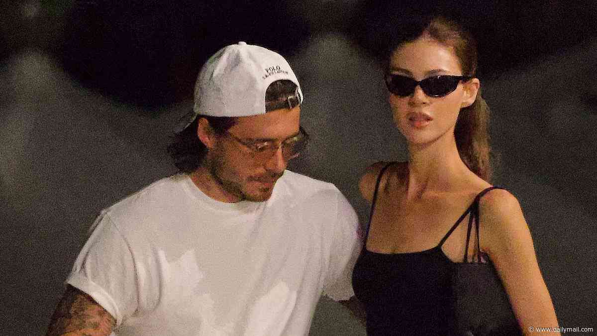 Brooklyn Beckham and Nicola Peltz cosy up to one another as they drink red wine in Venice ahead of her receiving a 'rising star' award