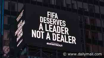 Furious soccer fans unveil Times Square billboard calling for Gianni Infantino to be ousted as they accuse embattled FIFA President of blackmail