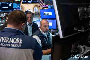 Stocks fall after a surprisingly strong jobs report raises prospects of an interest rate hike