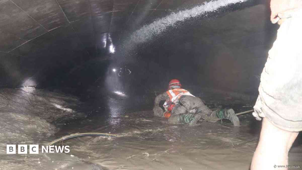 Nepal rescuers try to reach dozens trapped in tunnel after two found alive