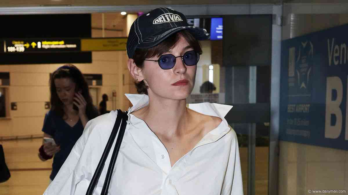 The Crown's Emma Corrin takes fashion notes from Princess Diana in chic Celine look as they arrive in Venice