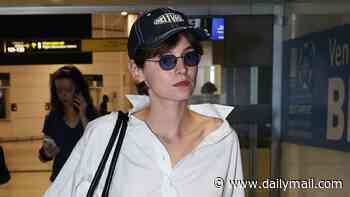 The Crown's Emma Corrin takes fashion notes from Princess Diana in chic Celine look as they arrive in Venice