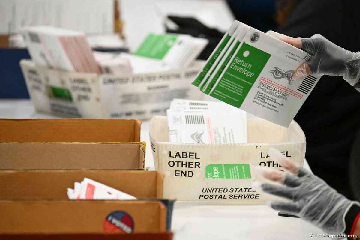 Judge blocks Trump’s new USPS rules for mail-in ballots with just weeks before midterm elections