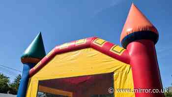 Two primary school children injured after being thrown from bouncy castle in Australia