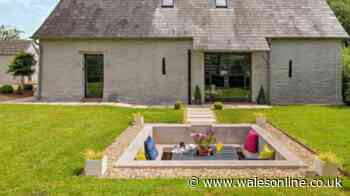 'Luxurious' barn conversion with 'expansive' Black Mountain views and quirky garden