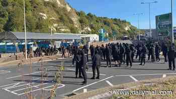 Balaclava-clad protesters blockade Dover 'in anti-migrant demo' as P&O warn holiday-makers of delays and police move in