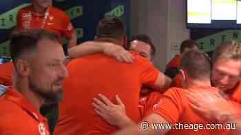 Swans staff share embraces in famous win
