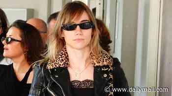 Suki Waterhouse embraces her inner rock chick in lace crop top and leopard print-collared leather jacket as she supports fiancé Robert Pattinson ahead of his premiere at Venice Film Festival