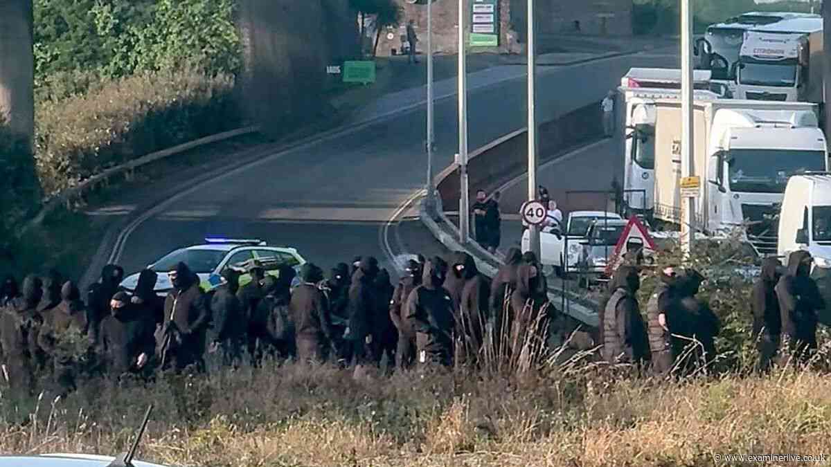 Hordes of balaclava-clad protesters block roads near major UK port as they're branded 'idiots'