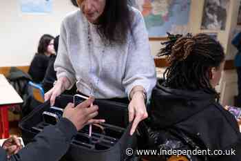 Smartphones are now banned in schools, but teachers are divided on how to enforce it