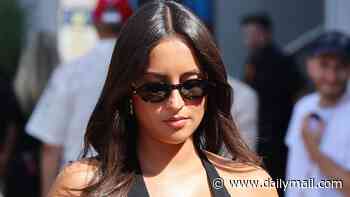 Charles Leclerc's wife Alexandra shows off her 'baby bump' in a black halterneck dress as she joins Formula One WAGs at Italian Grand Prix