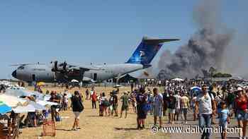Two pilots are killed when Greek air force fighter jet crashes at air show in front of 'stunned' crowd