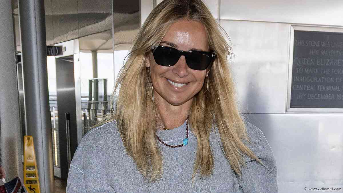 Louise Redknapp is all smiles as she jets off to Canada to film I'm A Celebrity spin-off with rarely-seen brother Joe Nurding - after 'splitting from her boyfriend of two years'