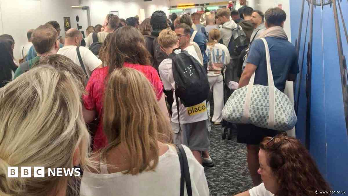 People stuck in airport corridor as shuttle stops