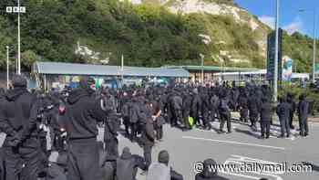 Anger as balaclava-clad mob bring Dover to a halt in 'stop the boats' protest with four-mile tailbacks leaving town gridlocked as hundreds miss ferries