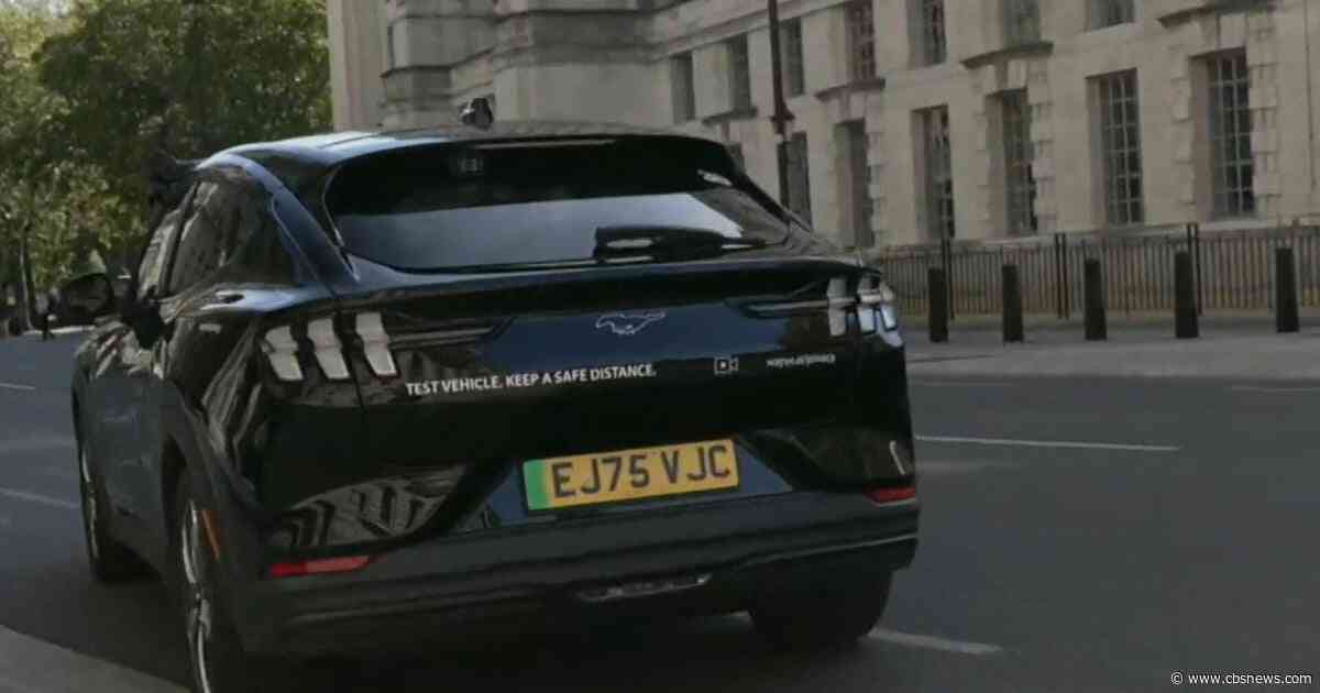 Watch: CBS News reporter tests out autonomous, AI-powered Uber in London