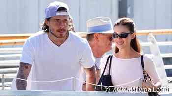 Brooklyn Beckham and wife Nicola Peltz beam as they make low-key departure from Venice Film Festival after loved-up red carpet appearance