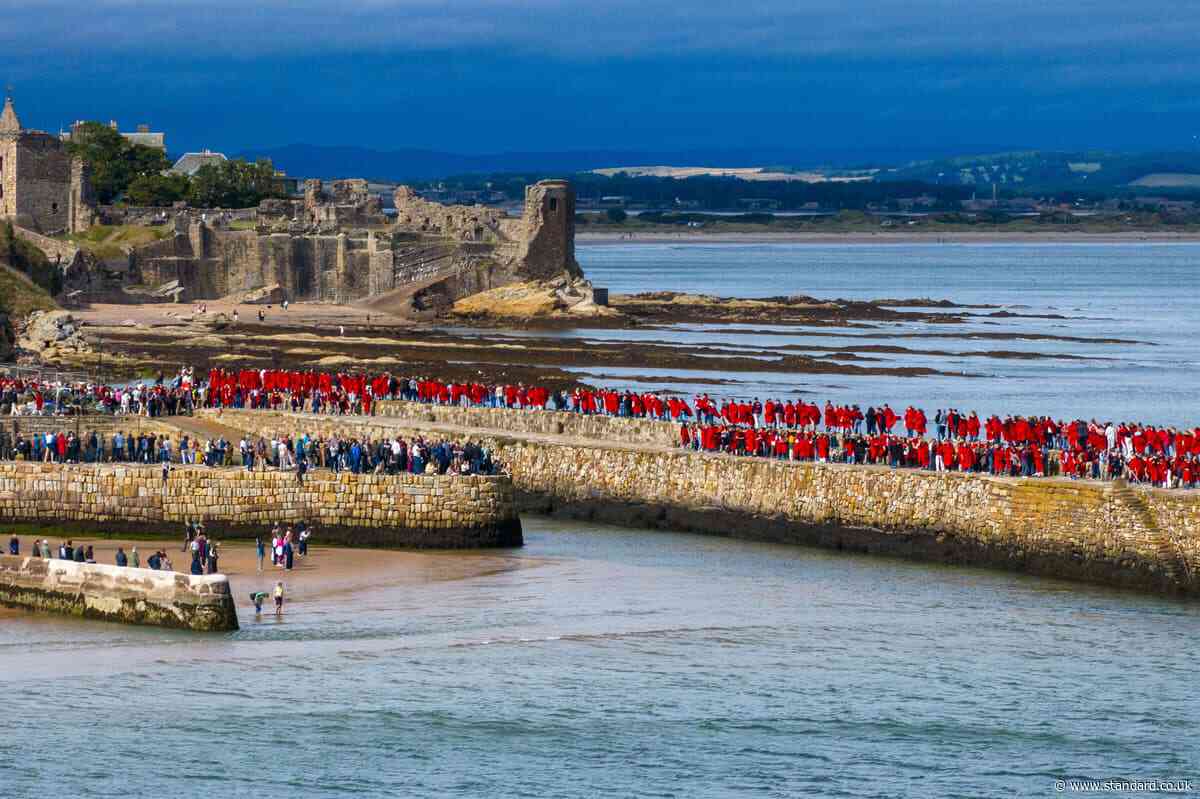 University of St Andrews students take part in traditional pier walk