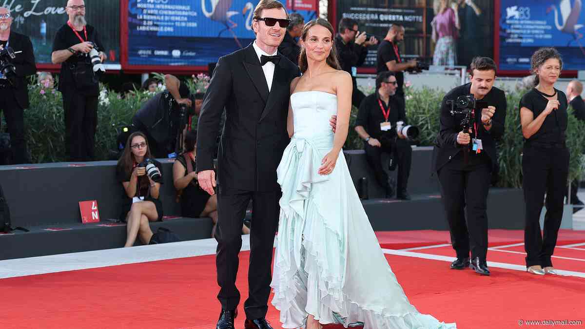 Alicia Vikander wows in a blue ruffled gown as she and husband Michael Fassbender lead the stars at The Echo Chamber premiere during the 83rd Venice Film Festival