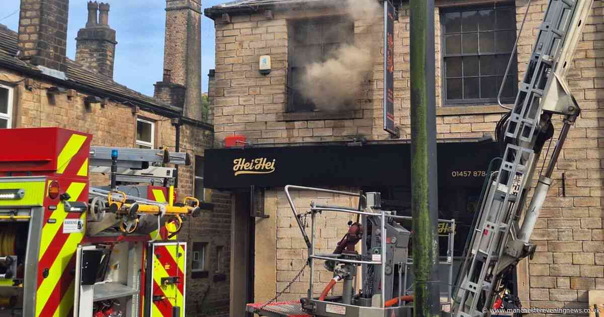 Three treated at scene after Uppermill takeaway fire sees high street shut off for hours