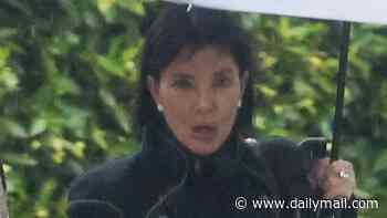 Kris Jenner braves the rain in a chic all-black ensemble as she steps out in LA... following her surprising beauty confession