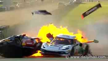 Moment Brit racing driver's Ferrari bursts into flames after smash... before 'superhero' rival rushes towards fireball and saves his life