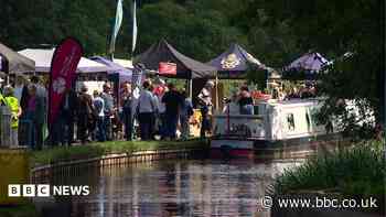 Hundreds attend canal festival at site of breach
