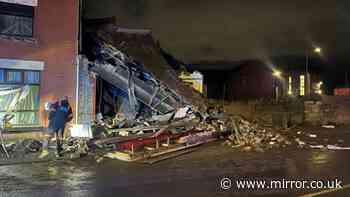 Van crashes into shop in Bolton as building collapses and road closed