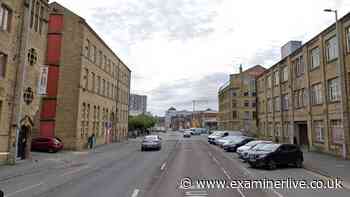 Huge police scene as woman's body found in notorious block of flats