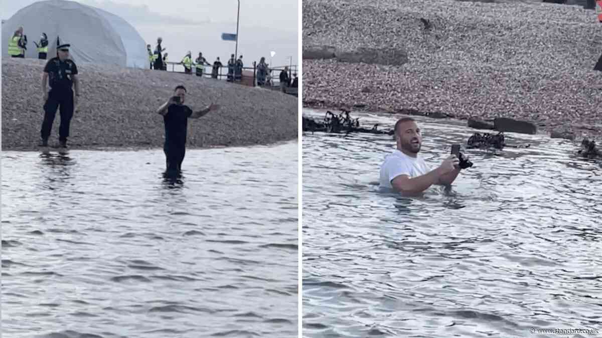Moment protesters wade into sea as rescued migrants arrive in Portsmouth