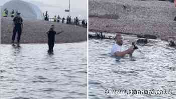 Moment protesters wade into sea as rescued migrants arrive in Portsmouth