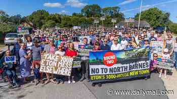 Hundreds of villagers protest over Eton College's 'shameful' plans to build new town with 3,250 homes that could 'wipe out' ancient hamlet