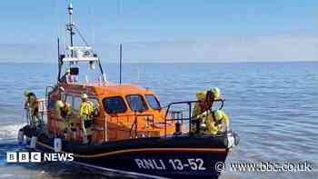 Four people rescued as sailing boat sinks off coast