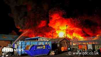 Crews to attend scrapyard blaze until end of week