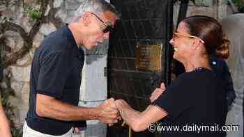 The George Clooney effect! Silver fox star, 65, charms giddy fan as he arrives for presidential dinner