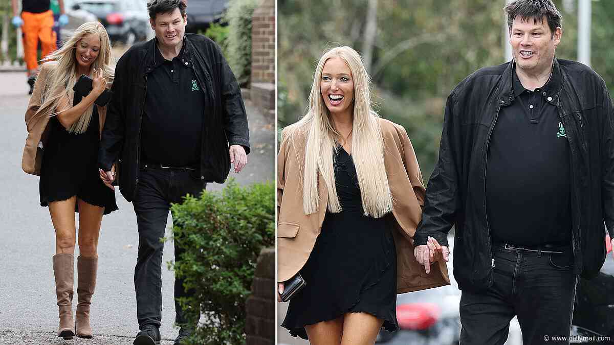 The Chase star Mark Labbett and girlfriend Hayley Palmer hold hands while leaving a London hotel as they are seen for the first time since confirming they are back together