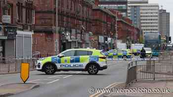Bootle police incident live as road cordoned off after 'loud bangs' heard