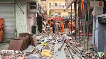 Rescuers dig through debris as seven dead in building collapse in Delhi