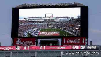 College football showdown descends into chaos after stadium suffers total power outage... before teams kick off without scoreboard or referee mics