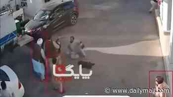 Taliban police tie hands behind man's back, beat him and shoot him dead in street execution caught on camera
