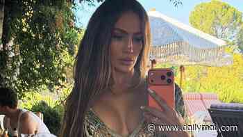 Jennifer Lopez, 57, poses in a plunging swimsuit as she snaps sultry selfies to celebrate Labor Day weekend