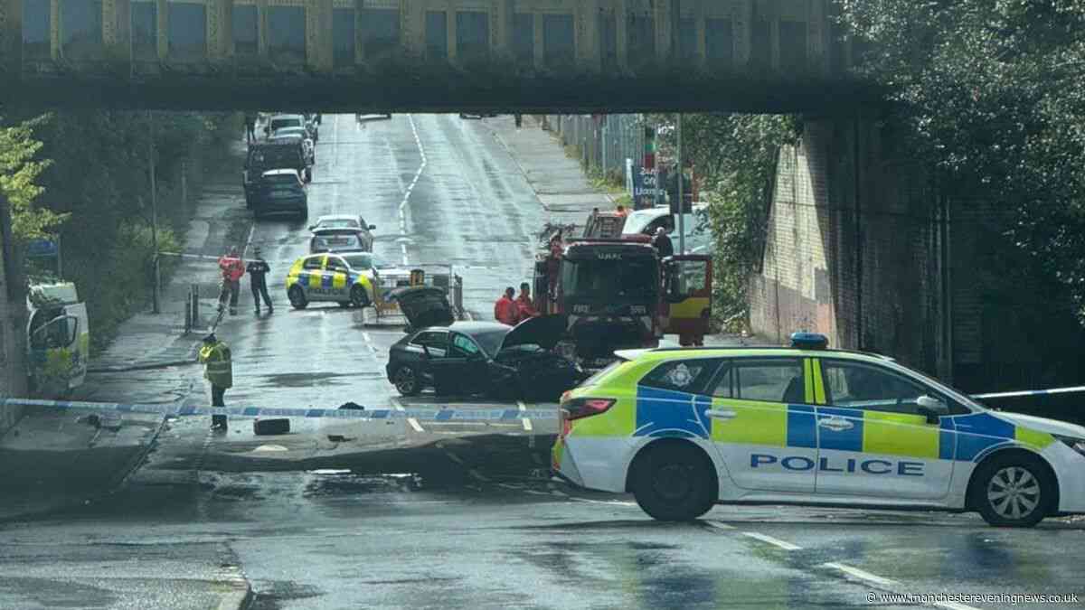 Three people including two officers hurt after police van in crash in Moston