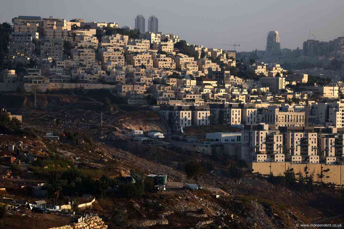 What are the Israeli settlements in the occupied West Bank and how has the UK sanctioned them?